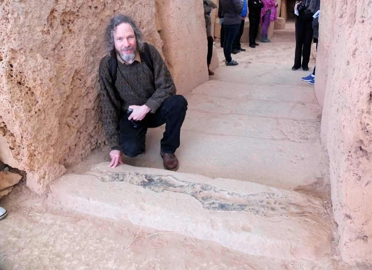 Image of Robert Schoch studying vitrification at the Temple of Mnajdra on Malta