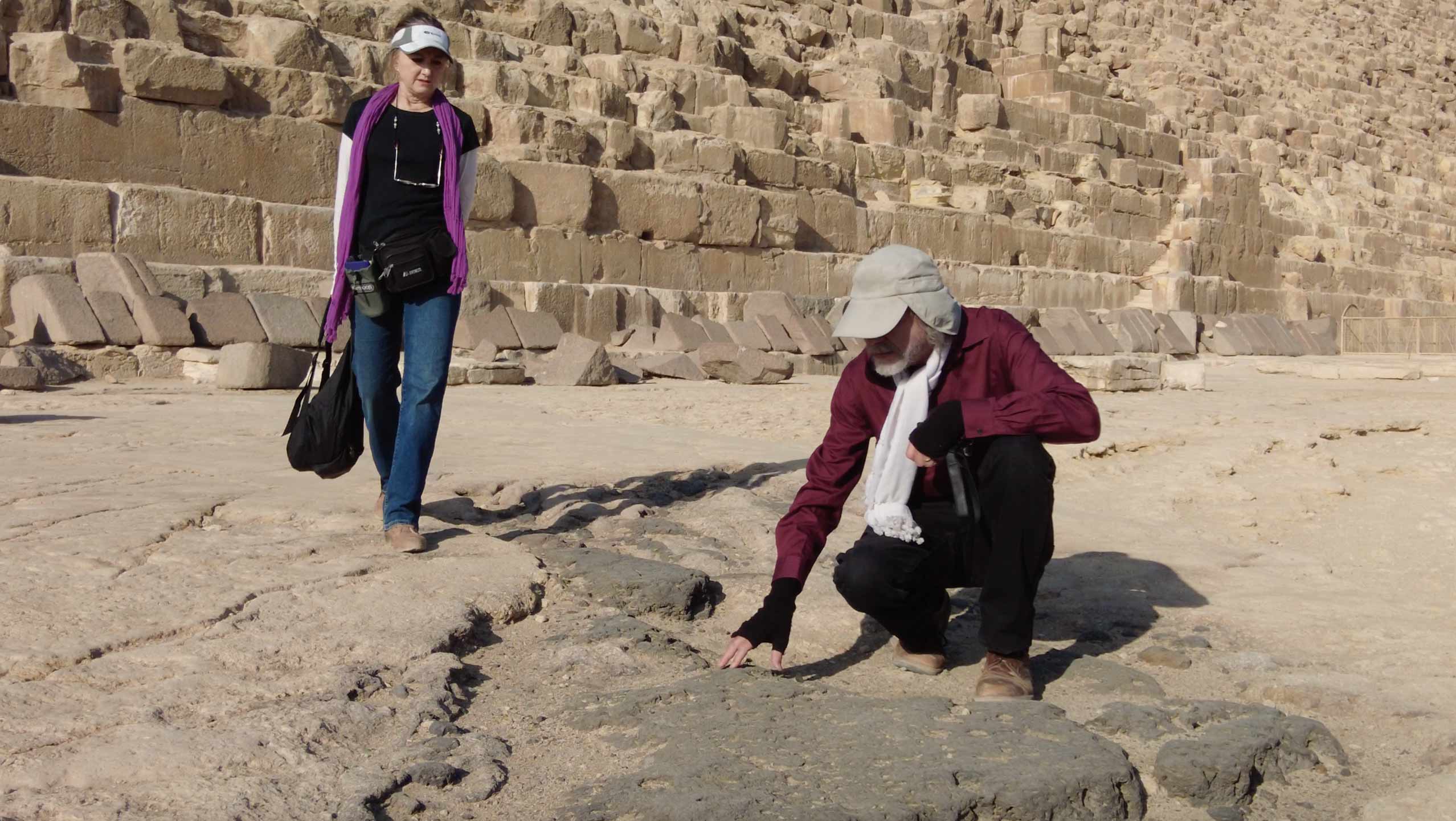 Image of Dr. Schoch and Catherine Ulissey studying vitrified bedrock near the Second Pyramid at Giza