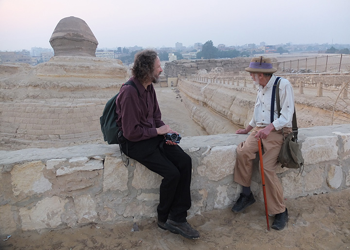 Robert Schoch and John Anthony West sitting together begind the Great Sphinx