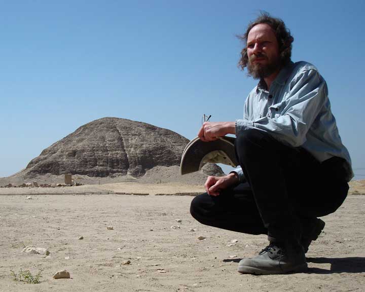 Image of Robert Schoch in 2009 in front of the so-called mud brick 
					pyramid at Hawara