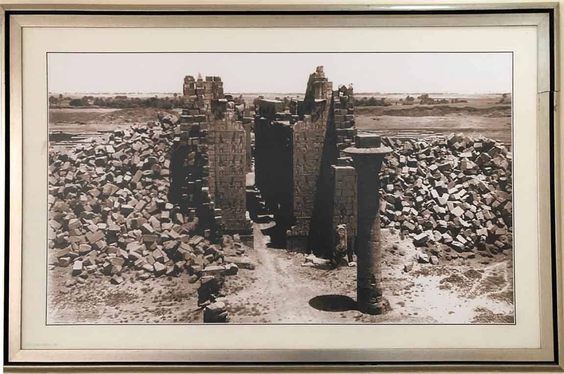 Historical photo of Karnak Temple with massive rocks piled around the tallest structures